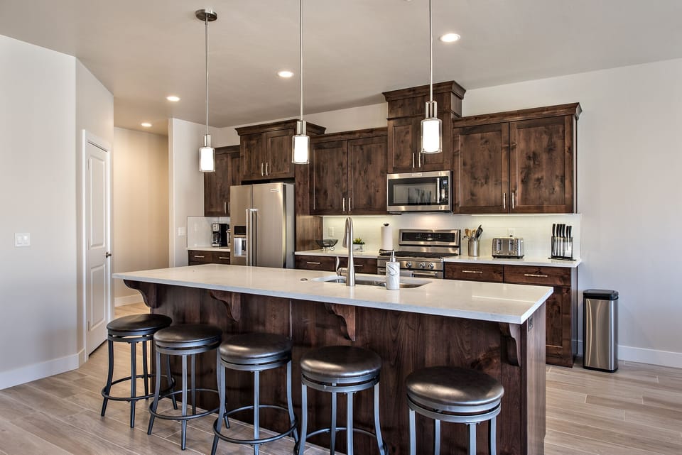 Kitchen - The kitchen is fully stocked with all the dishes, cookware, baking pans, and cutlery you will need for meal preparations and includes stainless steel appliances and granite counter tops.