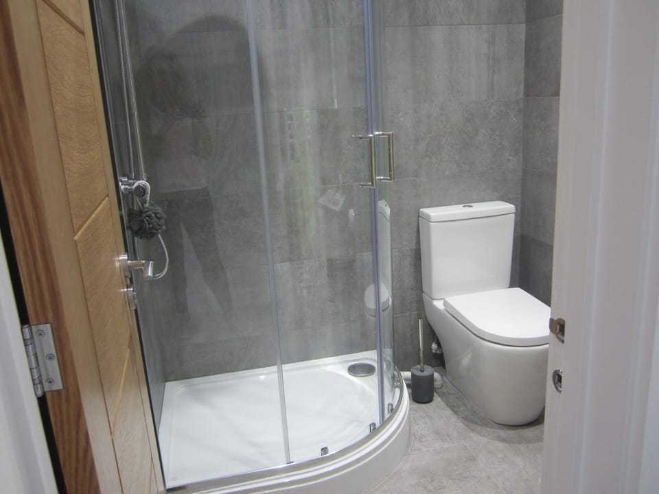 Shower facilities with Towels provided, Toilet Rolls and Soap. Sink and cabinet