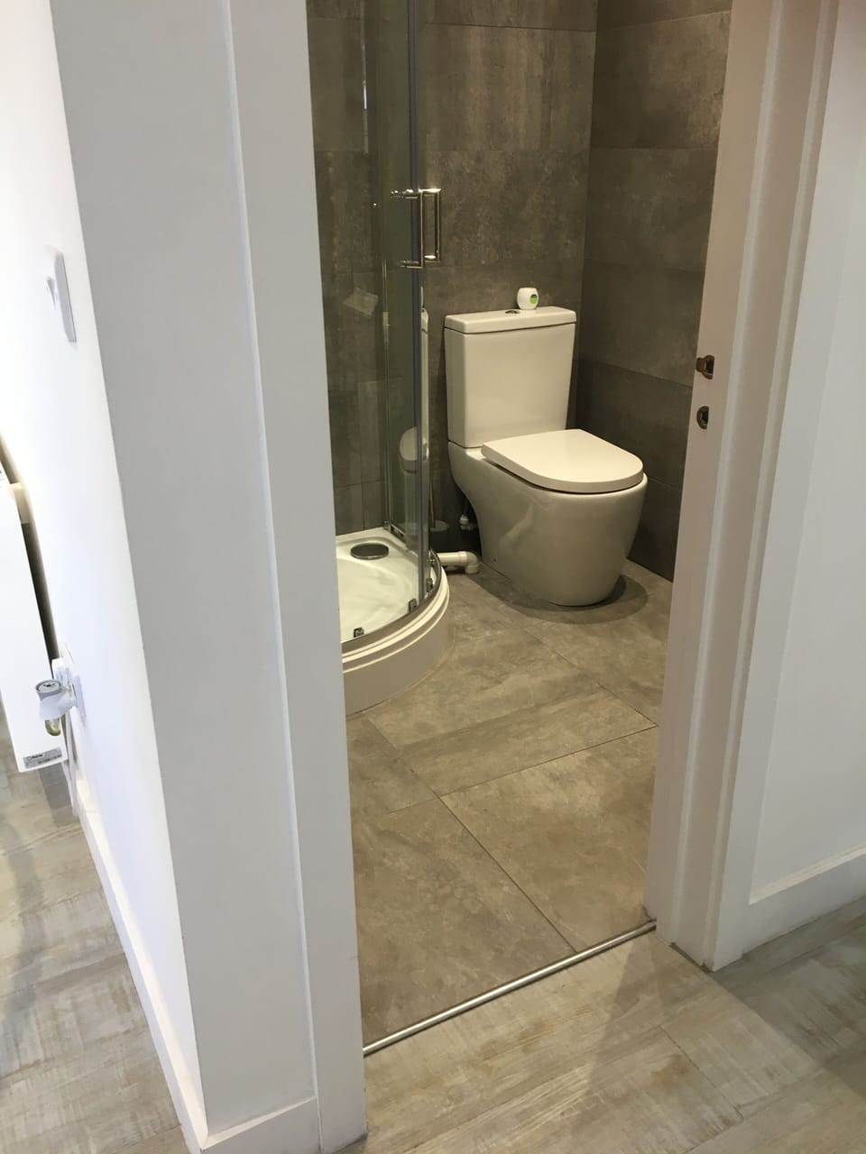 Bathroom on Flat. Shower has a raised ledge. Non slip bath mat in  Shower Tray.