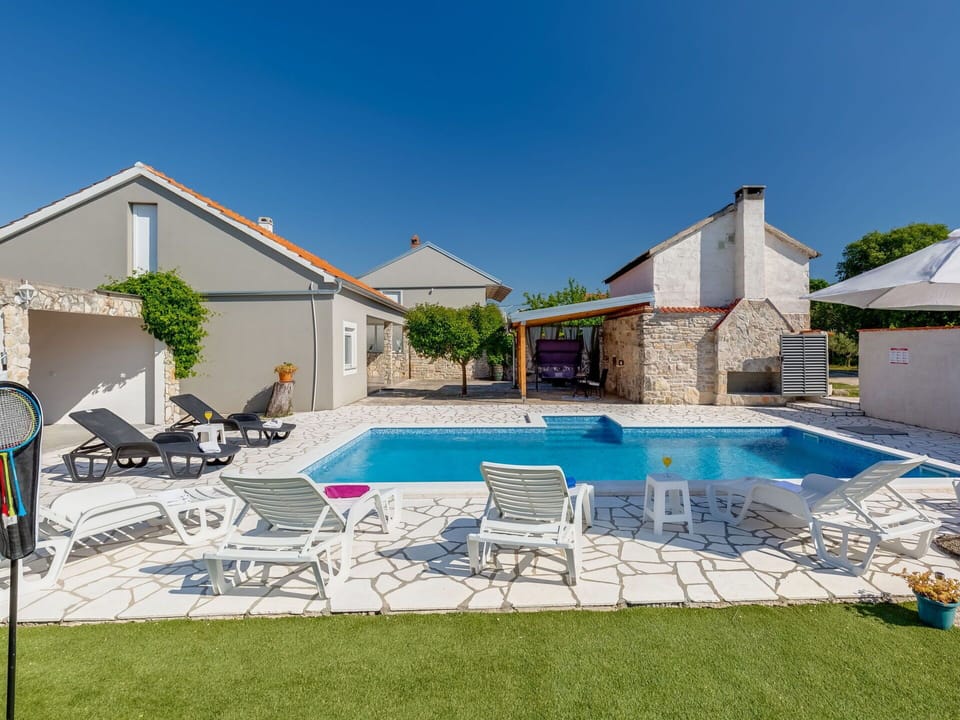 Sky, Water, Property, Building, Swimming Pool, Plant, Shade, Outdoor Furniture, House, Chair