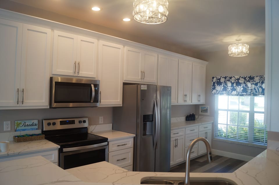 Completely new kitchen with custom cabinets, quartz countertops & new appliances