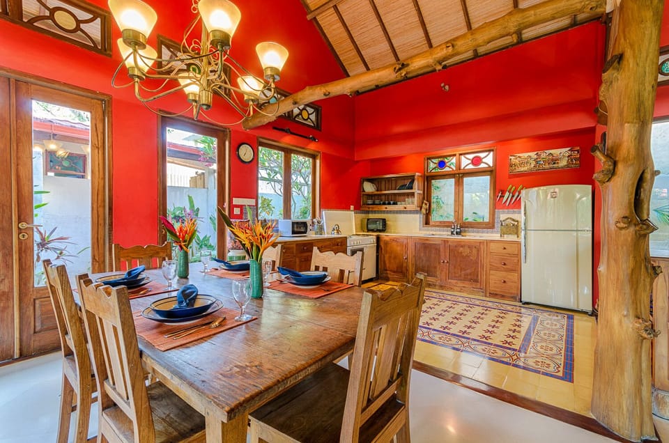 Dining table (seats 6 comfortably) and kitchen.