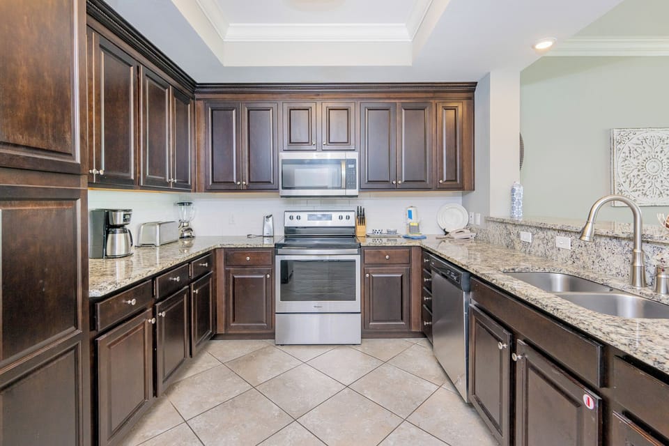 Enjoy crafting your favorite meals in a charming kitchen, surrounded by stainless appliances and elegant cabinetry