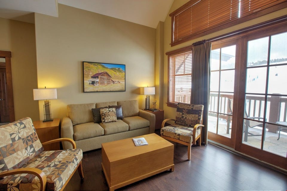 The living area features access to the private balcony or patio.