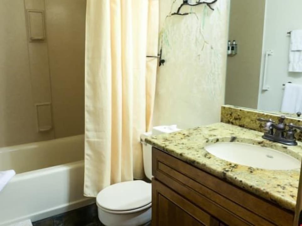 Get ready for the day ahead in the bright bathroom.