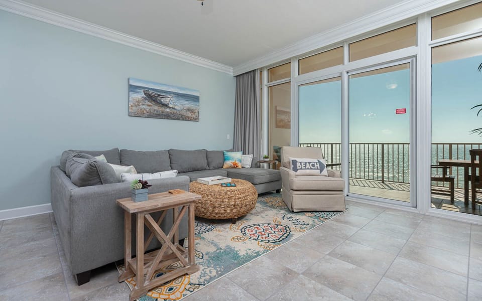 Relax in the spacious living area, enjoying the coastal views while sinking into the plush sofa with a queen sleeper