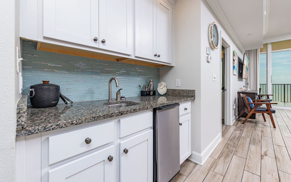 Unwind with refreshments at the wet bar, perfectly designed to enhance your beachside experience