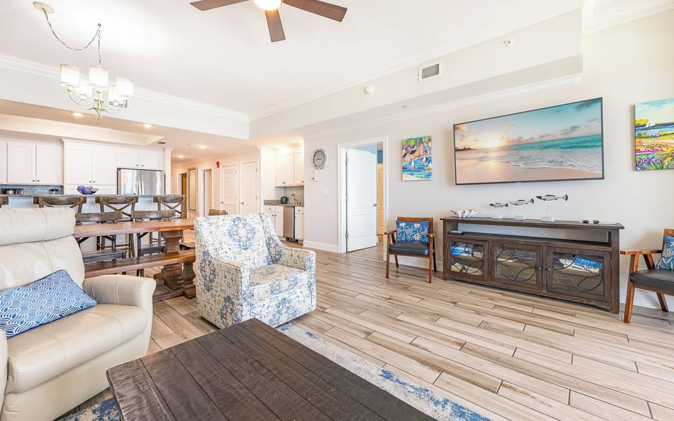 Gather in this welcoming living space and enjoy a good movie and stunning beach views from the balcony