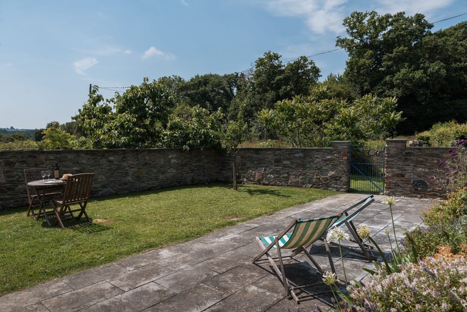 Sun trap garden over looking orchard and Salt Marsh Nature Reserve
