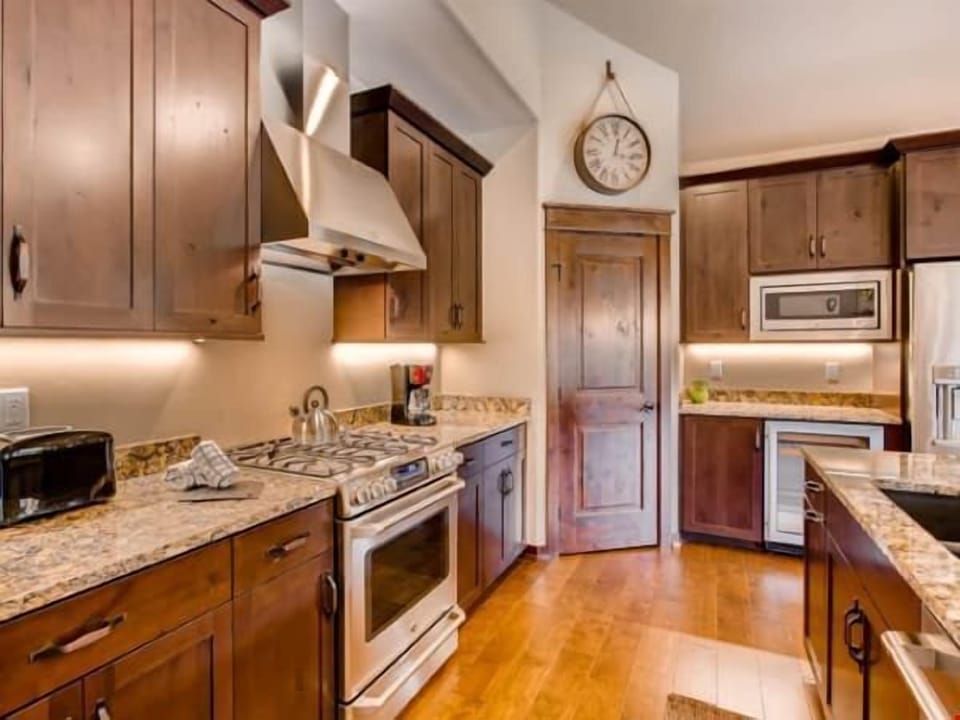 Prepare meals in the kitchen and take a seat at the breakfast bar.