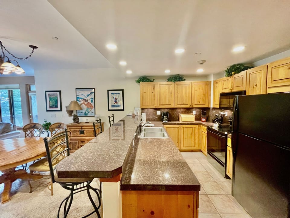 Spacious kitchen with a central island, perfect for preparing and sharing meals.