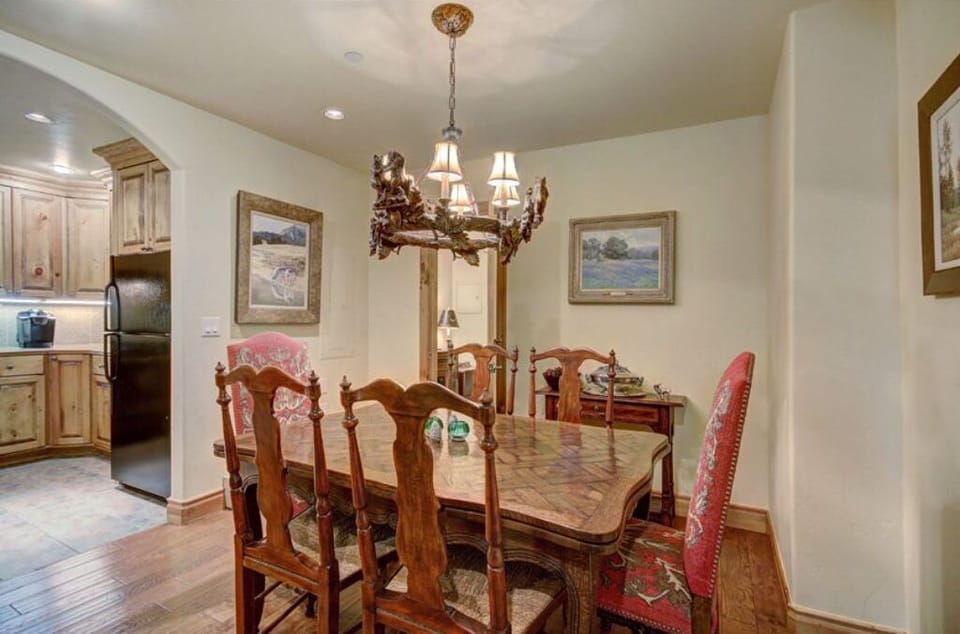 Elegant dining room with a classic chandelier and a welcoming atmosphere.