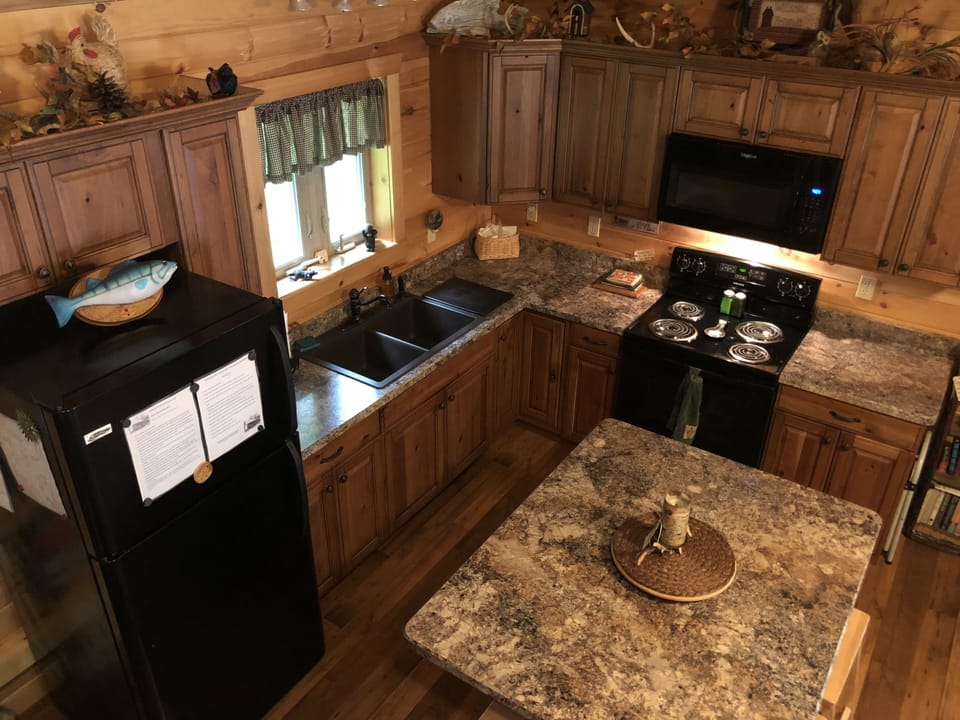 Fully equipped, the kitchen has all the essentials to cook & enjoy a meal.