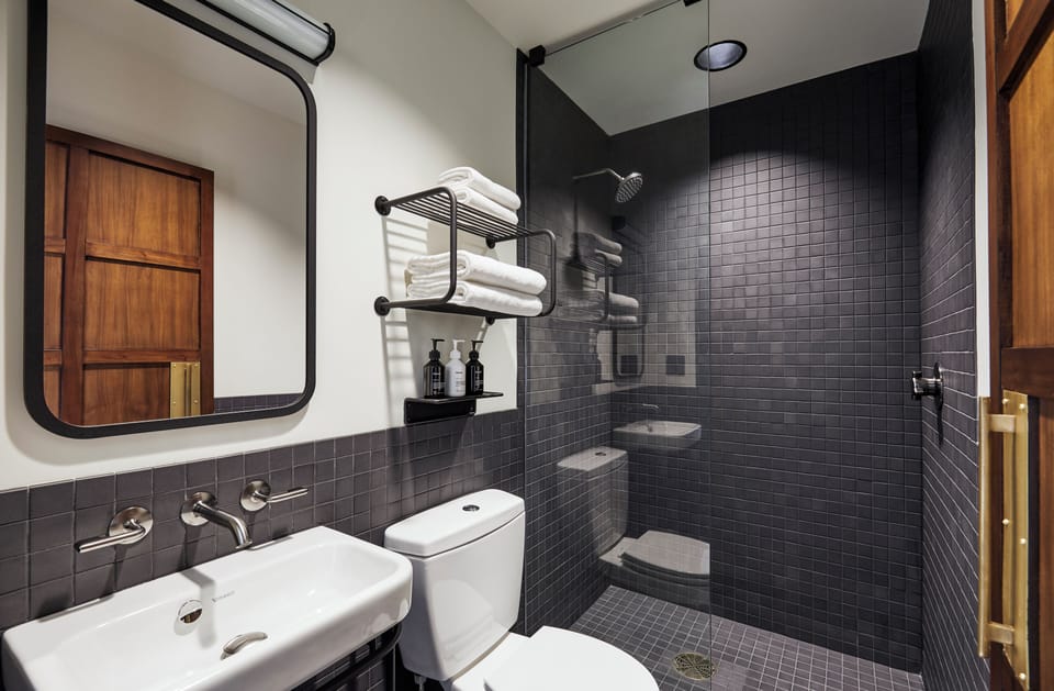 Shower, rainfall showerhead, hair dryer, towels