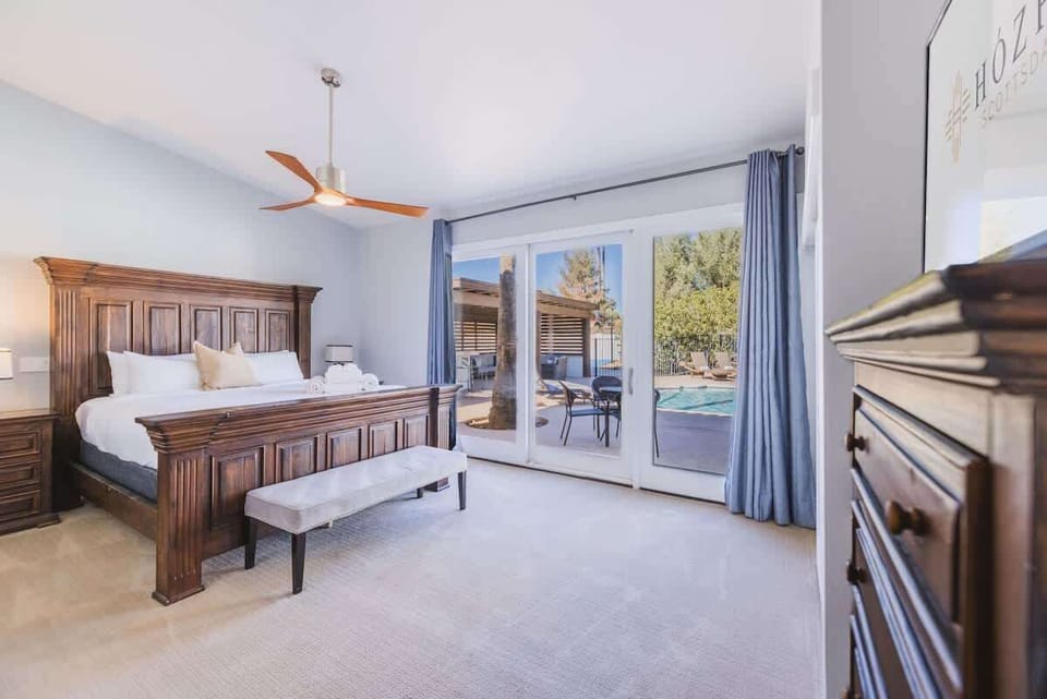 Bedroom 1 - Enjoy restful sleep, then slide open to sun and sparkling water.