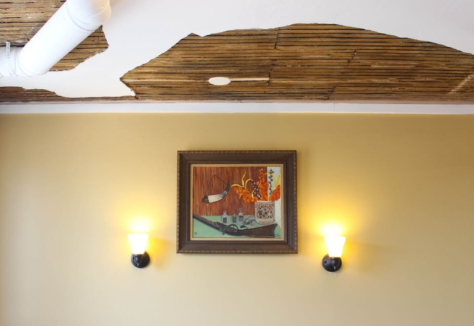 Rustic exposed wooden ceiling.