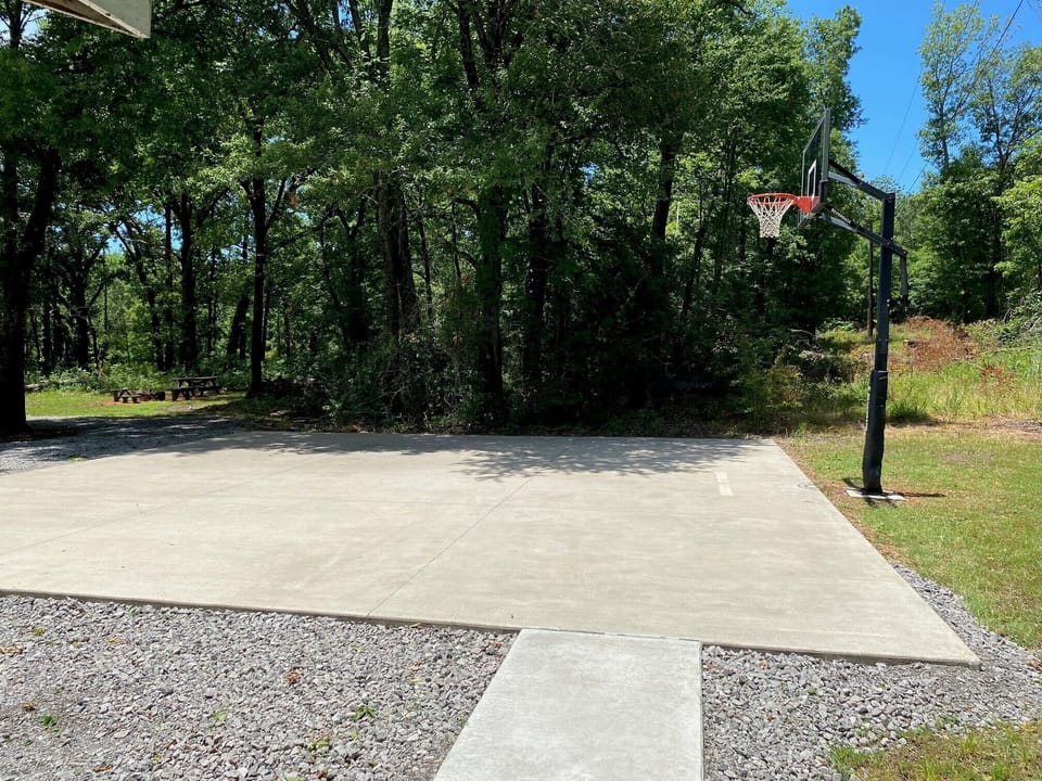 Driveway and basketball goal.