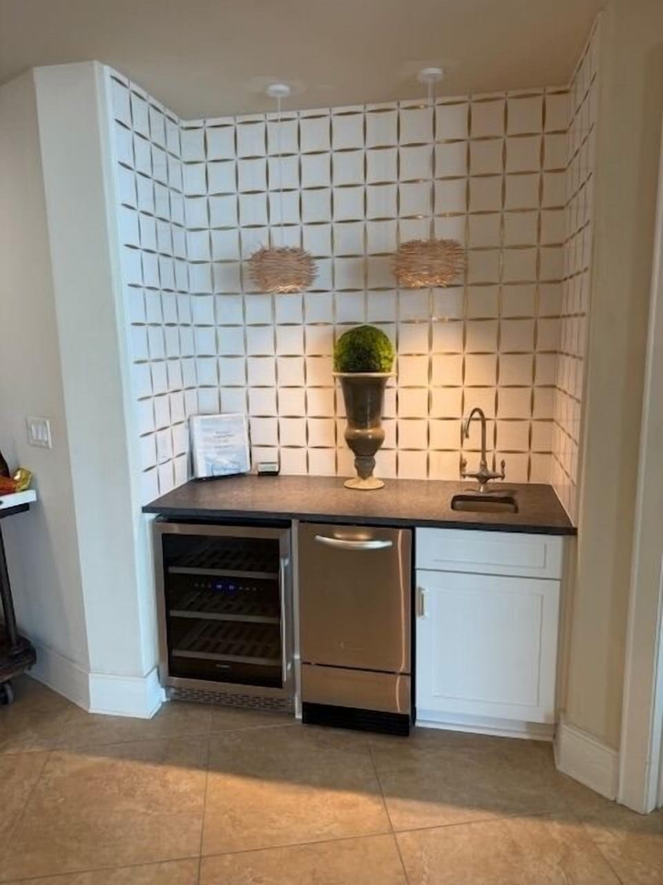 Wet bar updated ~ white & gold tile of entire wall and leathered gray granite.
