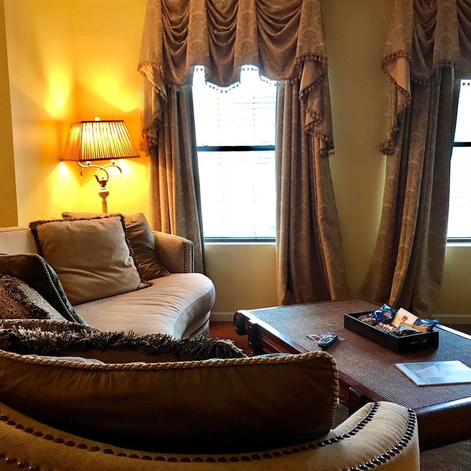 Signature Suite, 1 King Bed | Living room | Flat-screen TV