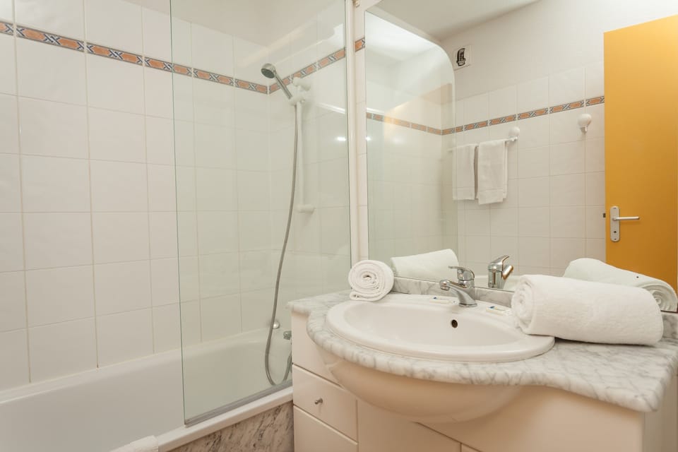 Get ready for your day in the lovely bathroom.