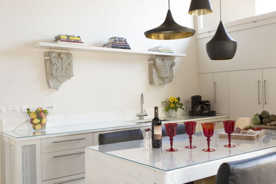Fully equipped Carrara marble kitchen counters.