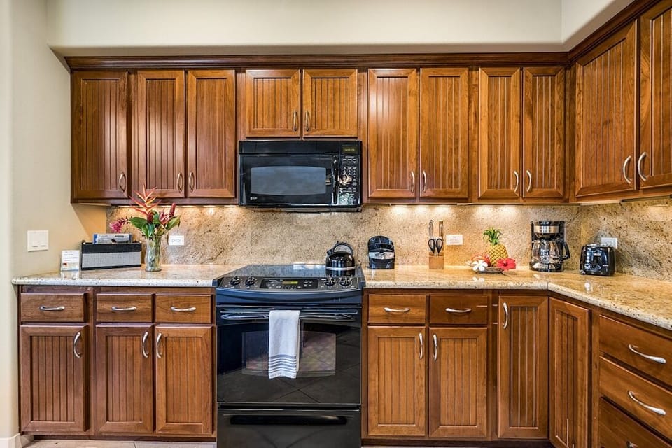 Kitchen with Wrap-Around Counters and Black Appliances
