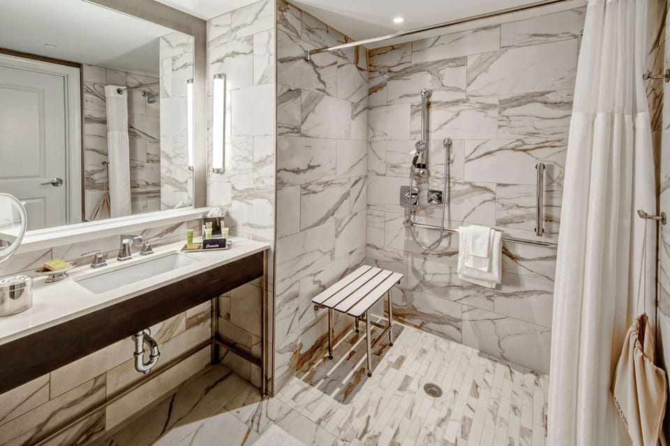 Designer toiletries, hair dryer, towels, soap