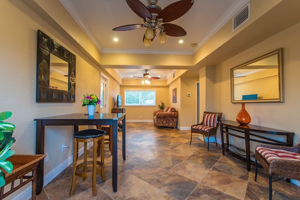 Coastal living room with waterfront views and comfortable seating areas.