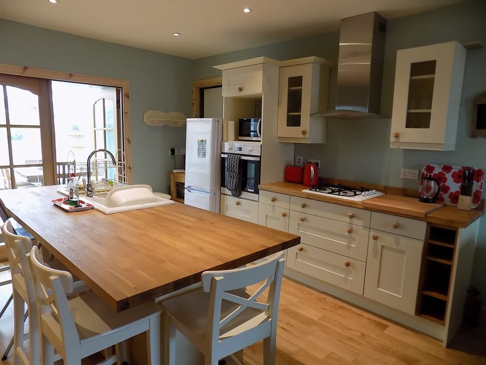 Kitchen with bar stool seating around the island
