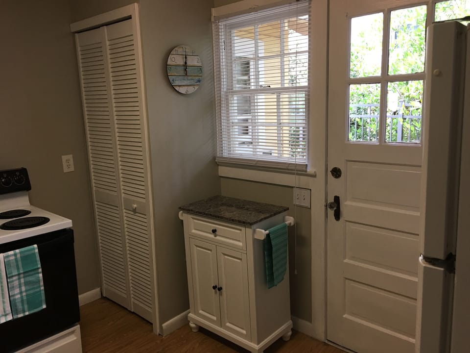 Kitchen with access to side yard