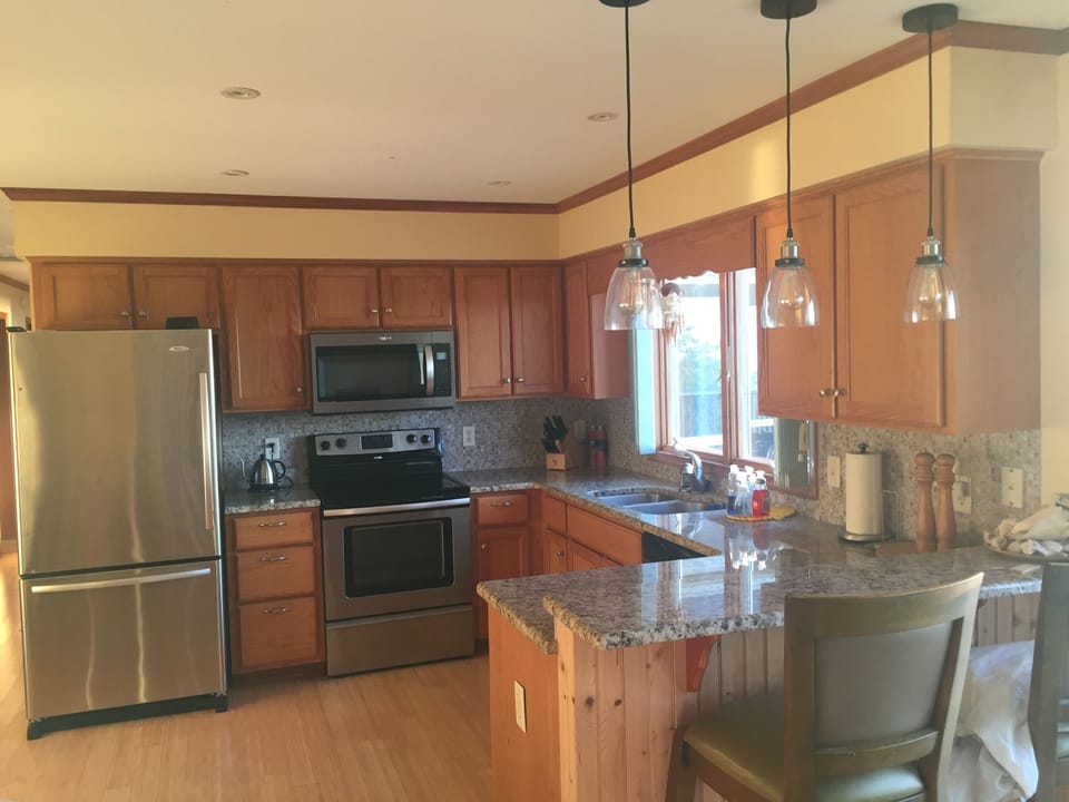 Kitchen with granite countertops and stainless steel appliances