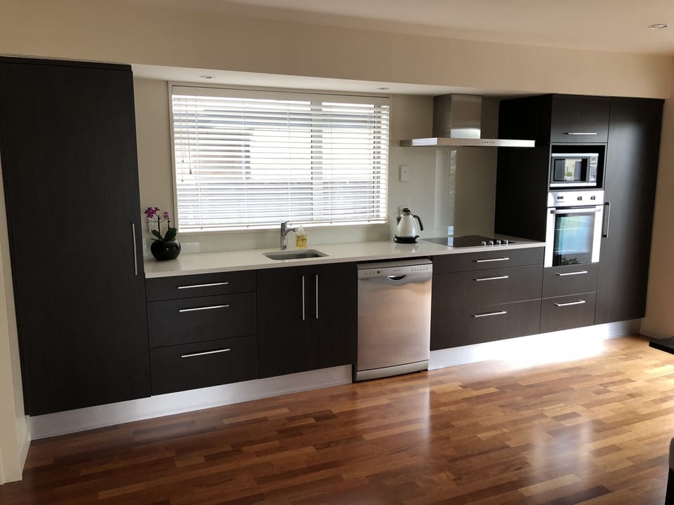 Fully equipped kitchen with stone bench tops & F&P appliances