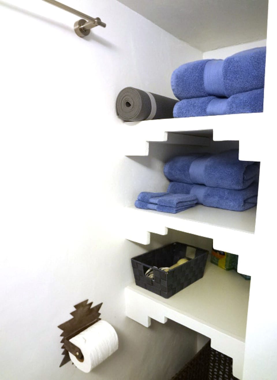 custom southwest designed bathroom shelving, yoga mat and hair dryer provided 