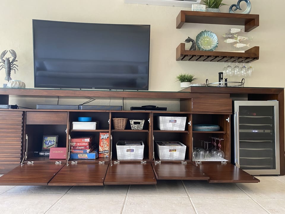 Beverage center with built-in wine refrigerator.  Lots of games, cards, & movies