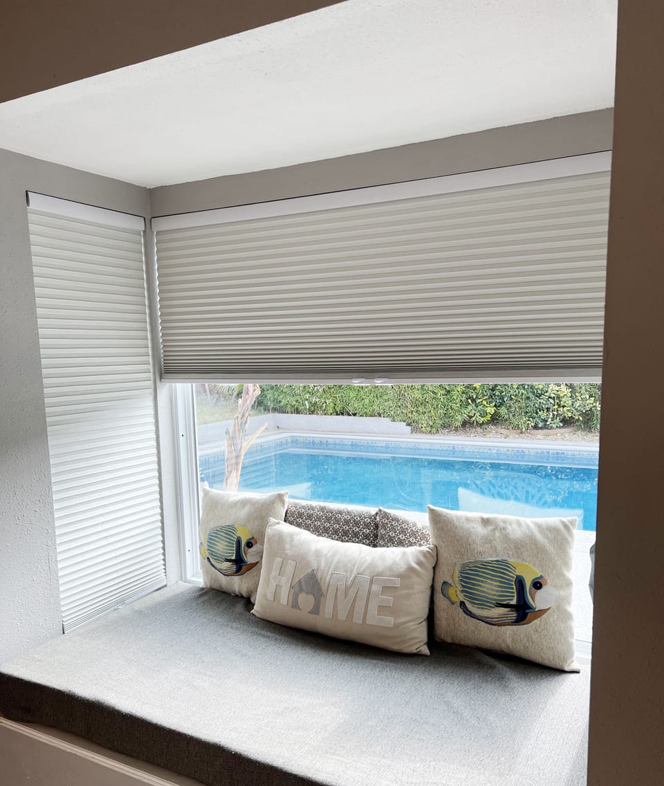 Bay window with a pool view. 