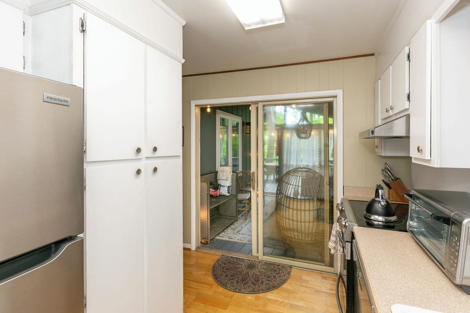 Kitchen opens to side screened porch