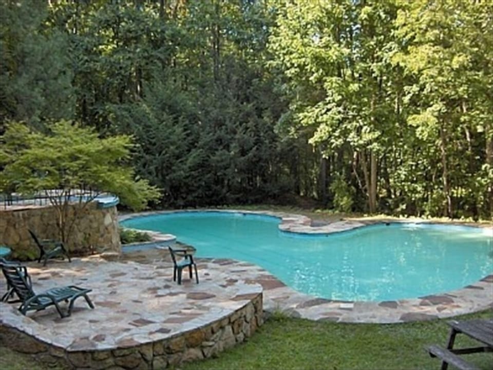 Stunning Outdoor Community Pool With Elevated Hot Tub. Tennis courts, too. 