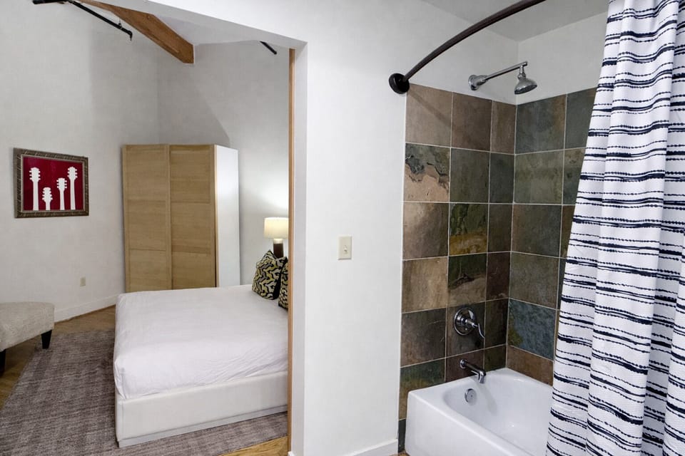 Jack and Jill bathroom with shower and laundry closet (there is a tub but we do not have a stopper on the drain for being able to take a bath)