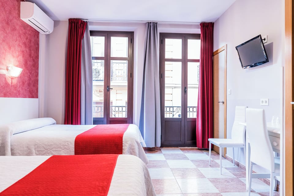 Quadruple Room | Desk, blackout drapes, iron/ironing board, free WiFi