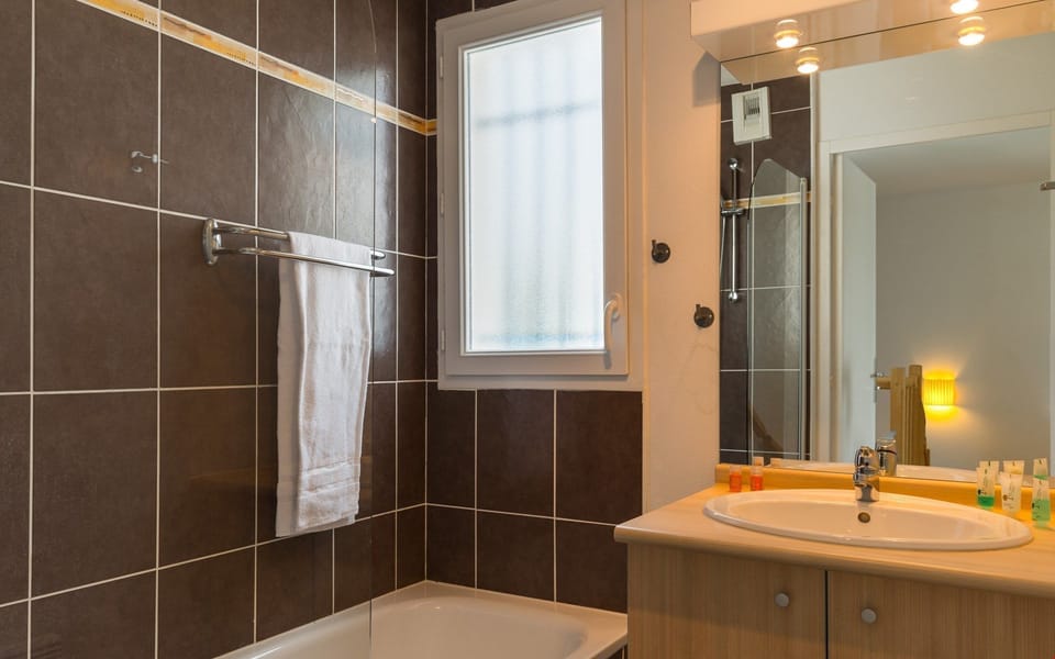 Get ready for the day in the bright bathroom.