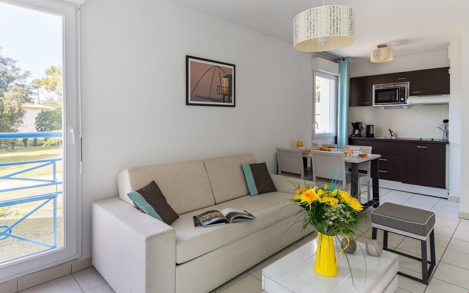 Sink into the plush sofas around the coffee table.