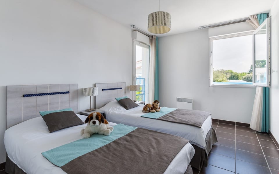 The second bedroom upstairs contains 2 Single beds.
