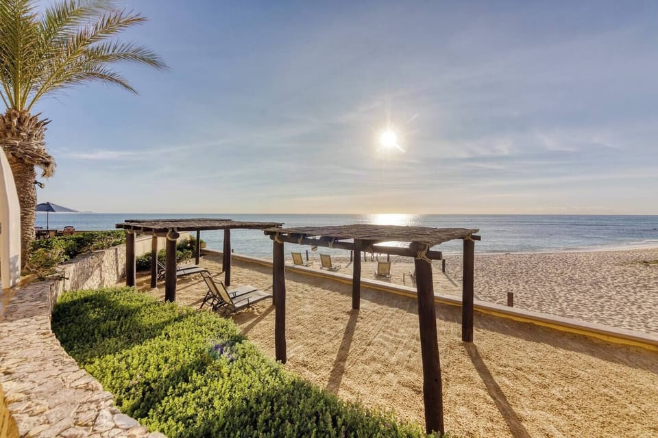 We have three levels of private in sand seating overlooking the beach.   There are loungers on the lower two levels, and tables and chairs with umbrellas on the upper level.  The second level also has thatched coverings over the lougers. 