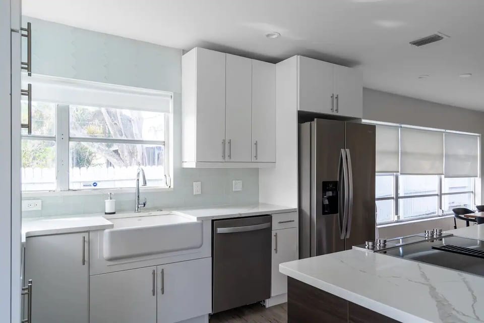 Kitchen with high-end cabinets, stainless appliances, and quartz countertops