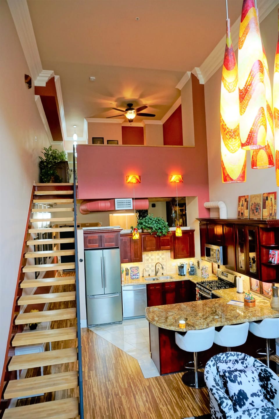 two story loft with a queen on top floor and another queen on the lower floor