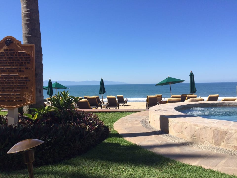 Poolside view of ocean. 