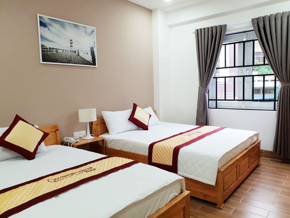 Deluxe Room | Premium bedding, desk, laptop workspace, blackout drapes