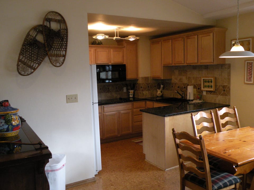 Upgraded Kitchen - with marble countertops, cork floors and plenty of windows