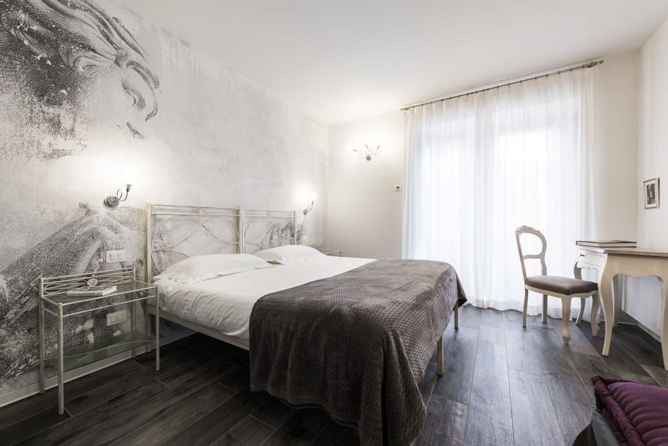 Apartment (Suite The Garden) | Down comforters, memory foam beds, in-room safe, individually decorated