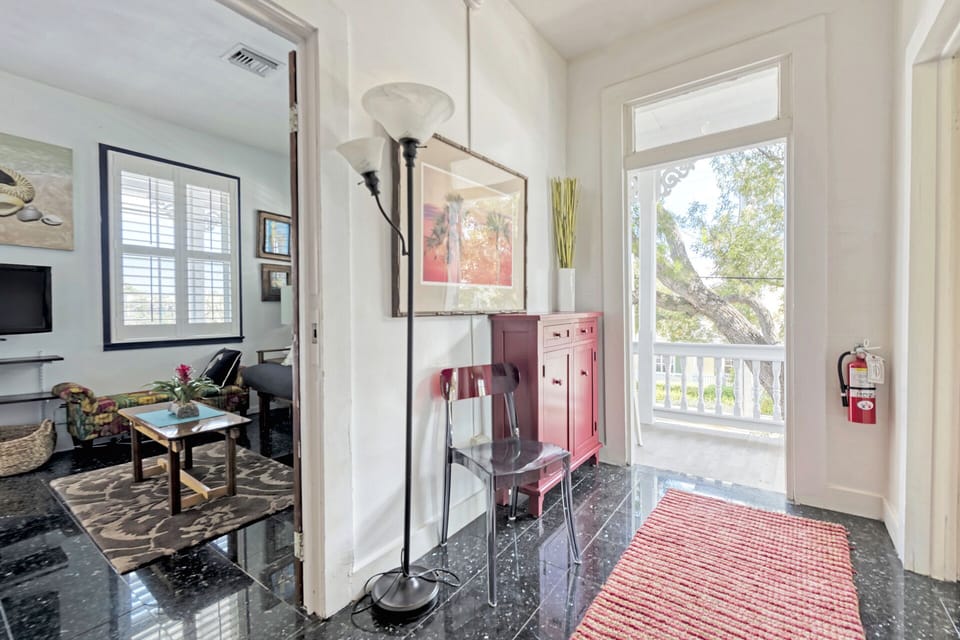 Upstairs hallway & master suite, looking out onto upper porch